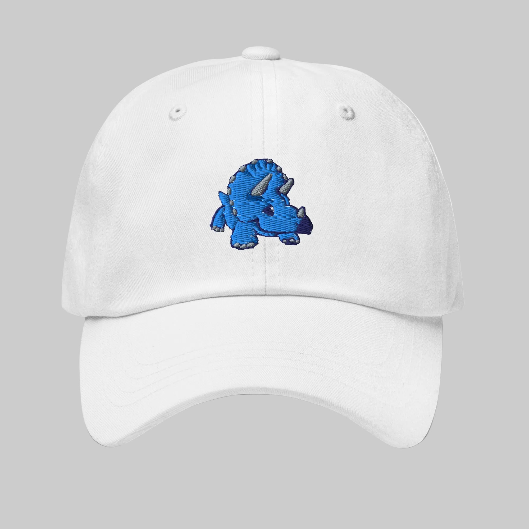 White cap with a blue dinosaur 