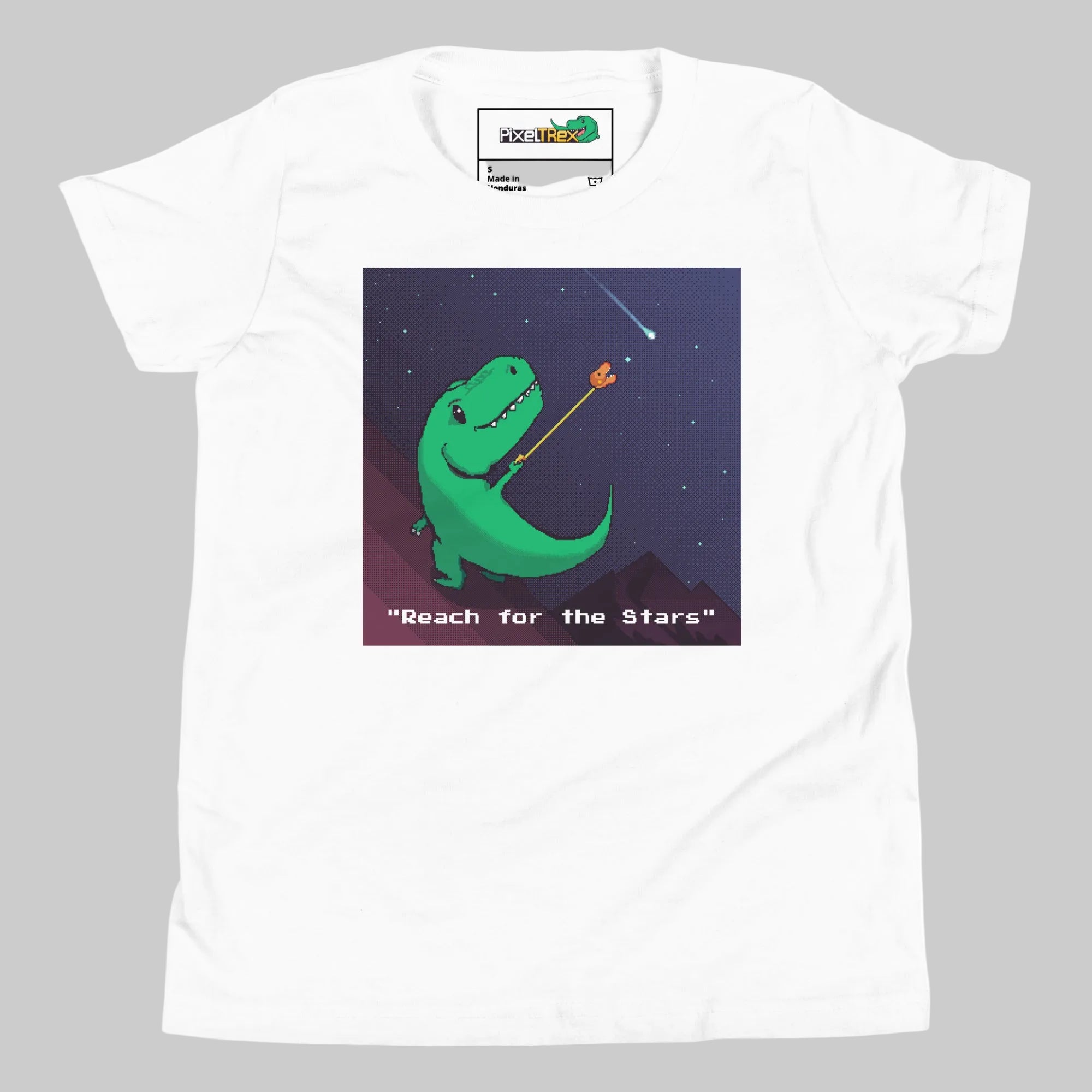 White t-shirt with a green dinosaur graphic and 'Reach for the Stars' text